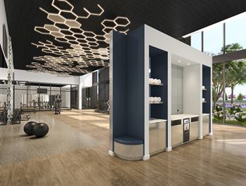 A gym with a variety of equipment and a large mirror.